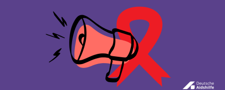 Megafon und rote Schleife